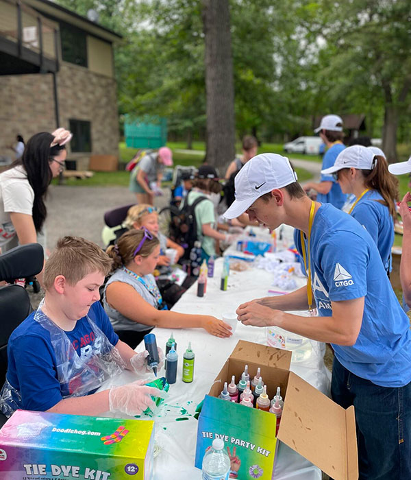 Dyeing clothes at MDA event.