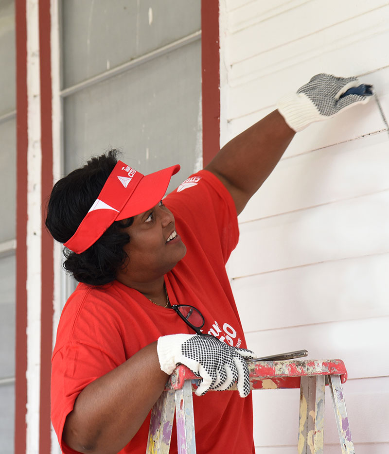 TeamCITGO painting homes.
