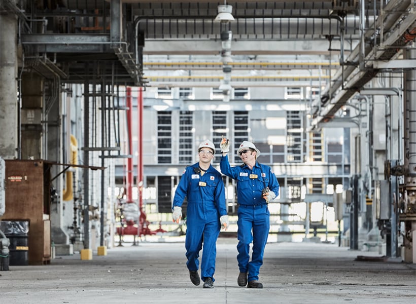 CITGO workers talking and walking around refinery