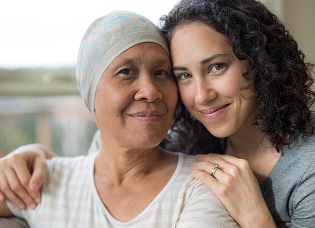 Mother and daughter in hospital setting.