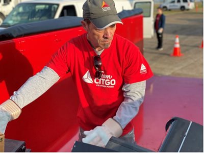 CITGO volunteer loading things into truck